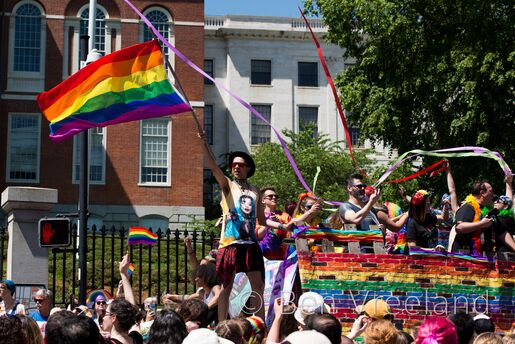 Waving of the LGBT pride flag on a float in the 2019 Boston pride parade