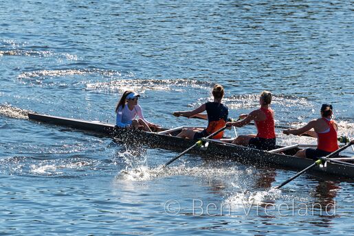 Coxswain of the University of Virginia women's rowing team instructing her team during the Head of the Charles Regatta