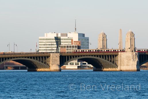 An MBTA Red Line train crosses Boston's Longfellow Bridge in front of the Museum of Science