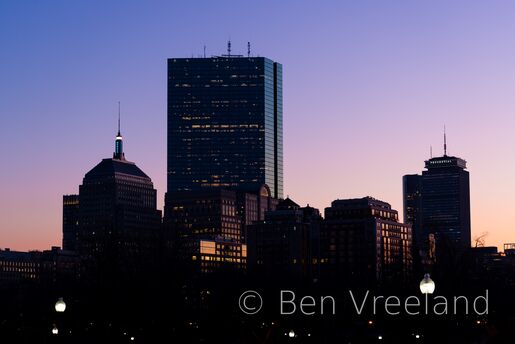 Boston's Back Bay skyline illuminated by a fading purple sunset