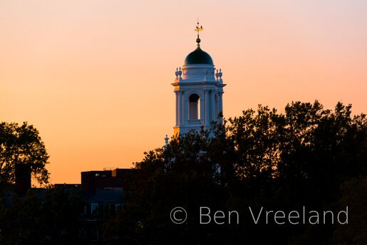 Creamy orange sunset on the domed belltower of Eliot House on Harvard University's campus